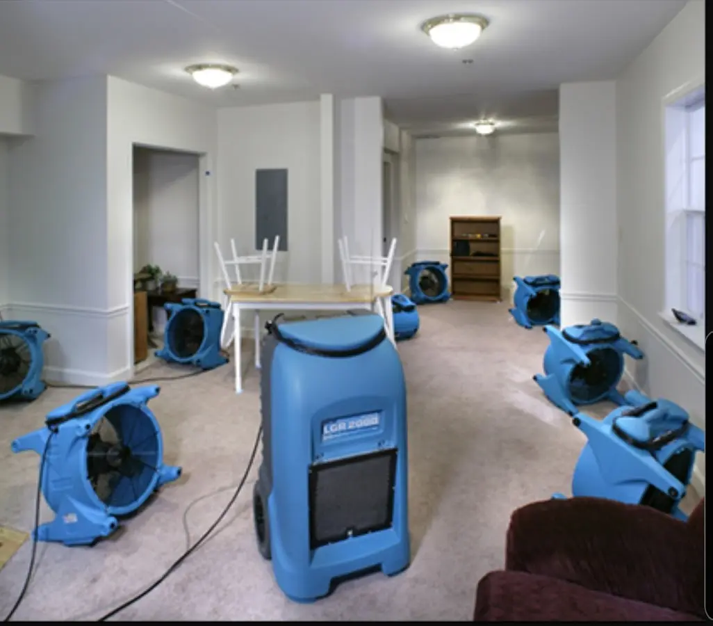 Air movers and dehumidifier setup for Water Damage Restoration in Mayfair